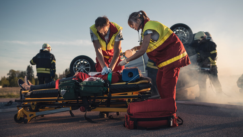 On The Car Crash Traffic Accident Scene: Paramedics Saving Life