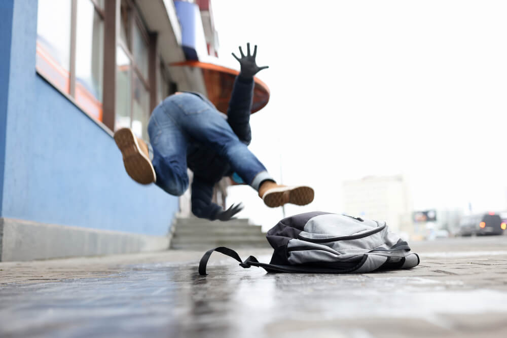 Man slips and falls on sidewalk