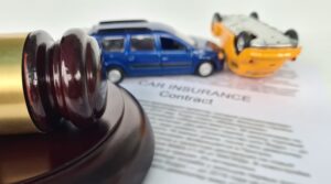 Judge gavel car accident and insurance contract. Litigation financial damage after accident