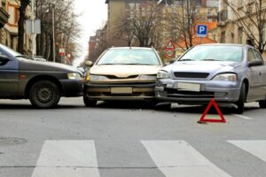 Three-car collision on the street.